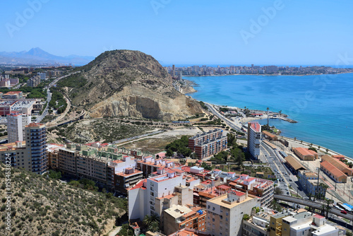 Aerial View of Coastal Alicante with Serra Grossa Hill, San Juan Bay, and Cape Cabo de las Huertas on a Clear Mediterranean Day