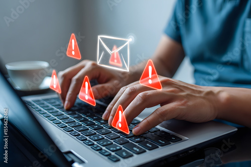Cybersecurity alert: Person receives urgent email notification with multiple warning signs on laptop.