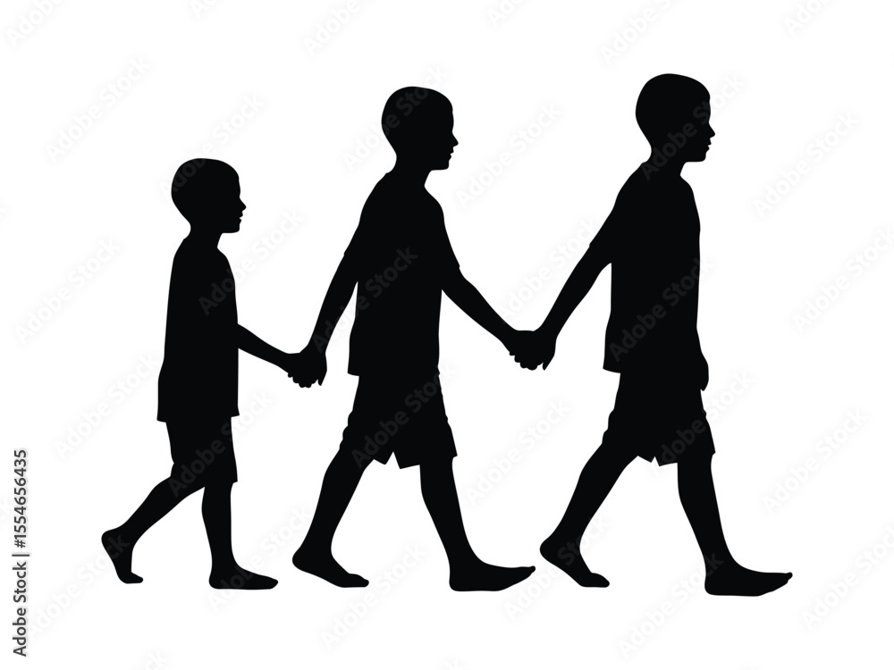 Three children holding hands while walking along a path on a sunny day in a park Three children holding hands while walking along a path on a sunny day in a park