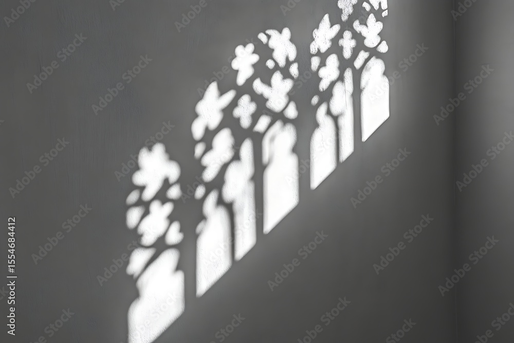 Obraz premium Sunlight casting intricate window shadows