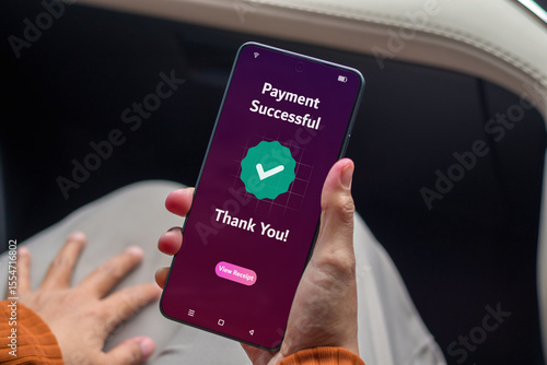 A woman making payment for online shopping using a mobile phone. Online payment successful concept.