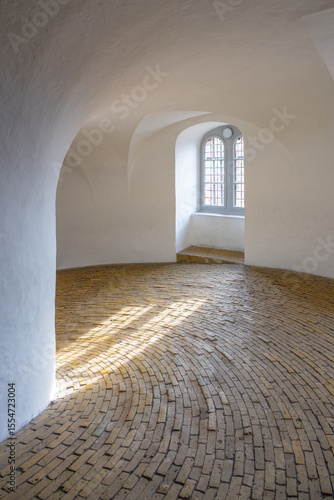 Photography Visitors ascend the spiral ramp of the Round Tower, experiencing a unique architectural feature
