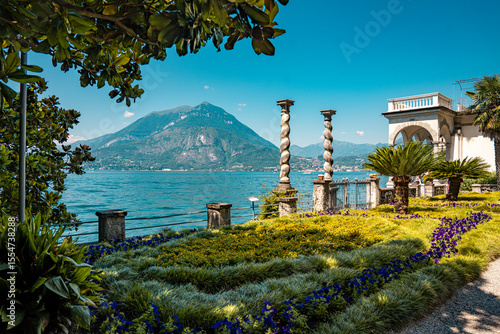 Fototapeta Naklejka Na Ścianę i Meble -  Lush Botanical Garden of Villa Monastero Overlooking Lake Como: Elegant Historic Estate Surrounded by Mediterranean Flora and Alpine Scenery