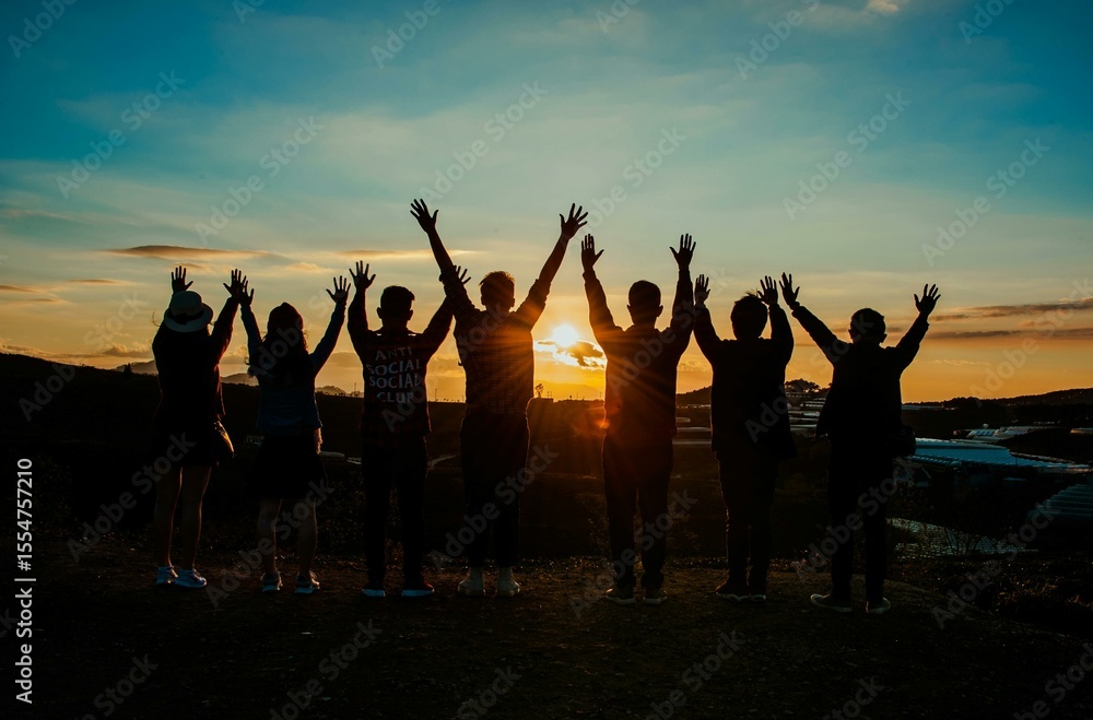 group of people at sunset group of people at sunset