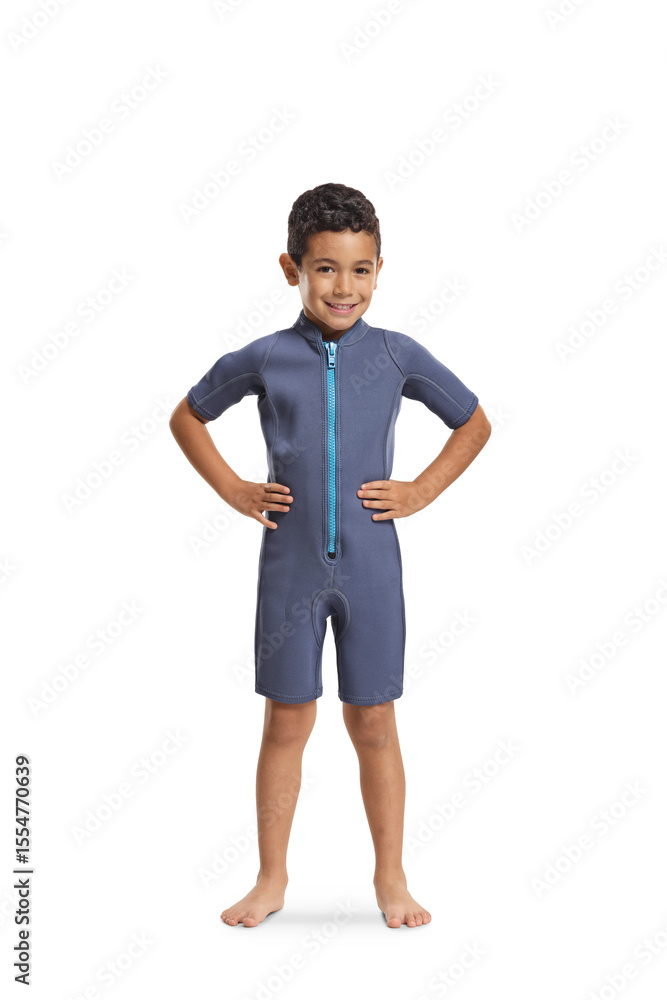 Fototapeta premium Full length portrait of a boy wearing a wetsuit