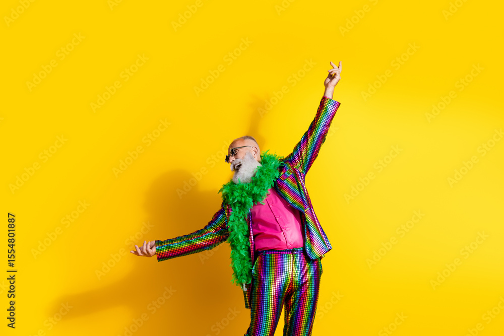 Fototapeta premium Photo of good mood charismatic man wear stylish bright outfit dance masquerade party isolated on yellow color background