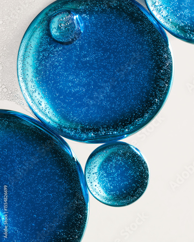 Blue bubbles floating and reflecting light creating abstract pattern