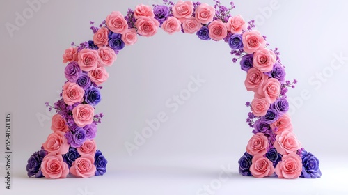 Floral arch of pink and purple roses against a white backdrop