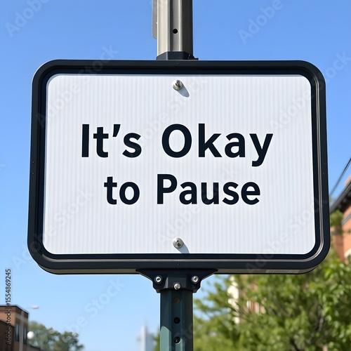 Street Sign That Says “It’s Okay to Pause”

Description: A street corner sign boldly displaying “It’s Okay to Pause” — promoting self-care, mental health, and emoti