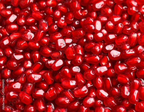 Photo-realistic Background Fully Covered with Fresh Pomegranate Seeds.