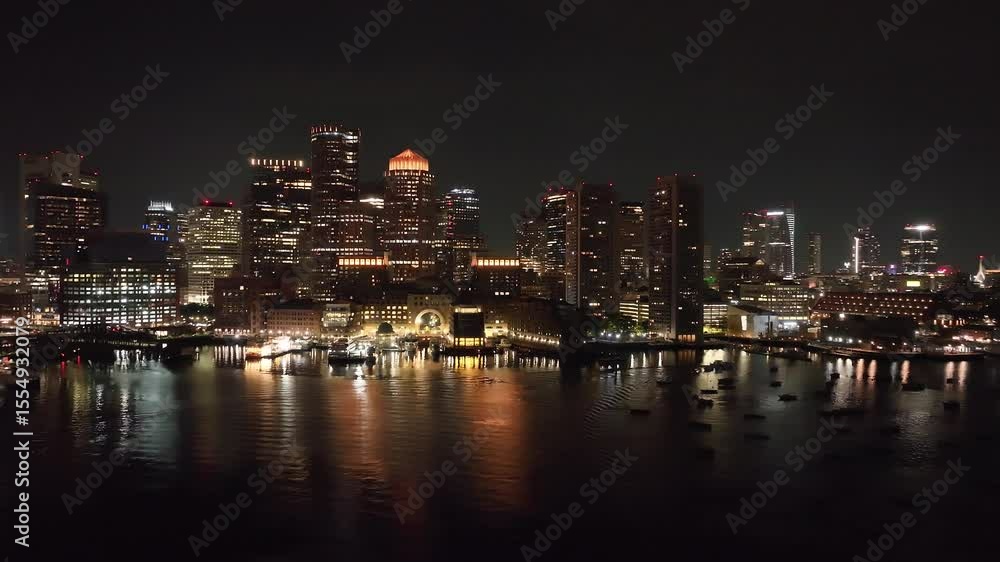 Stunning Nighttime Pan of Boston Harbor Skyline Reflections Stunning Nighttime Pan of Boston Harbor Skyline Reflections