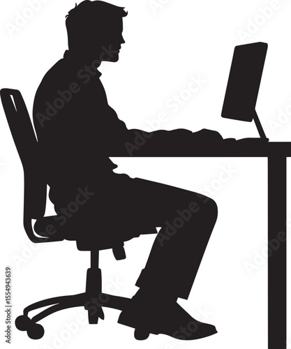 A business person seated at a desk, concentrating on a computer screen.