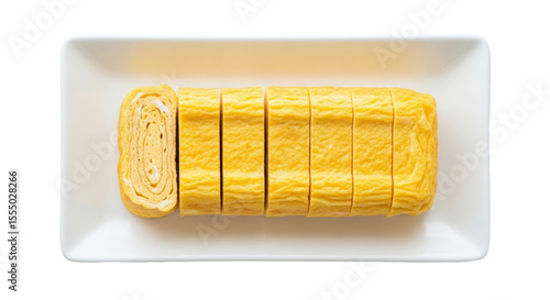 Overhead View Of Sliced Tamagoyaki On A White Rectangular Plate Against A Transparent Background
