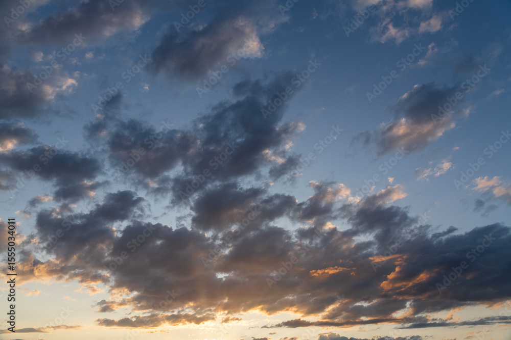 Fototapeta premium Beautiful orange sunset sky, with clouds,. Evening sky background.