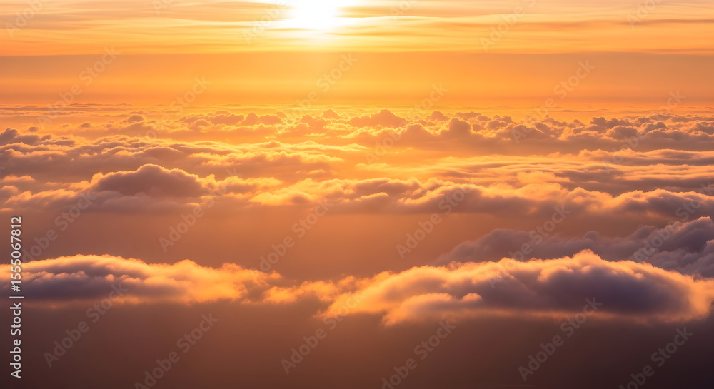 Fototapeta premium Golden Sunset Above a Sea of Clouds Aerial View