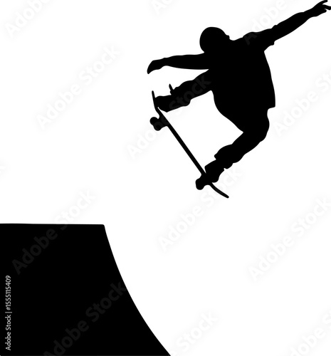 silhouette of a young man jumping on a skateboard