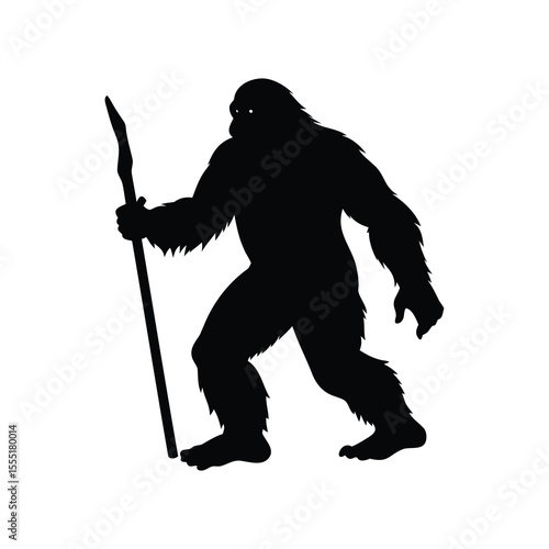 Silhouette of Bigfoot or Sasquatch Carrying a Walking Stick Through the Forest