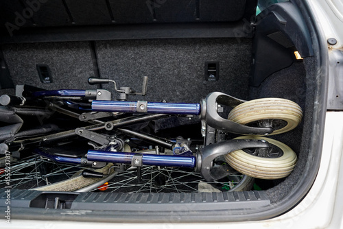 Wheelchair folded in the trunk of a car
