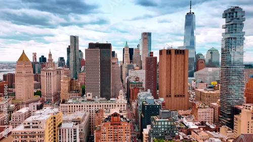 Panorama of modern New York, USA. Drone flight over the variegated scenery of metropolis under overcast sky.