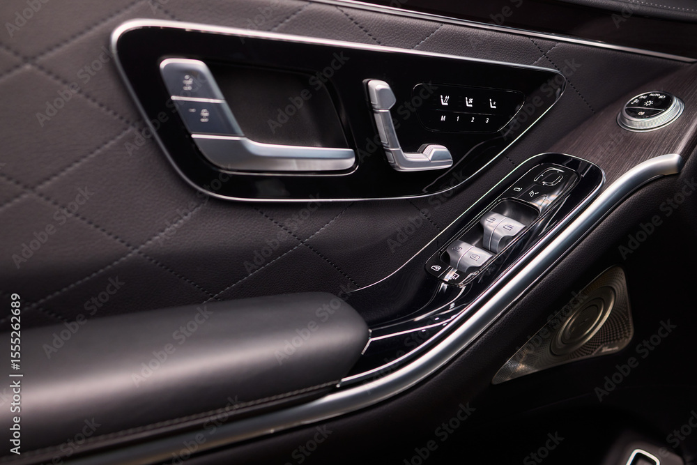 Naklejka premium Modern Car Door Control Panel with Window Switches for convenience and functionality