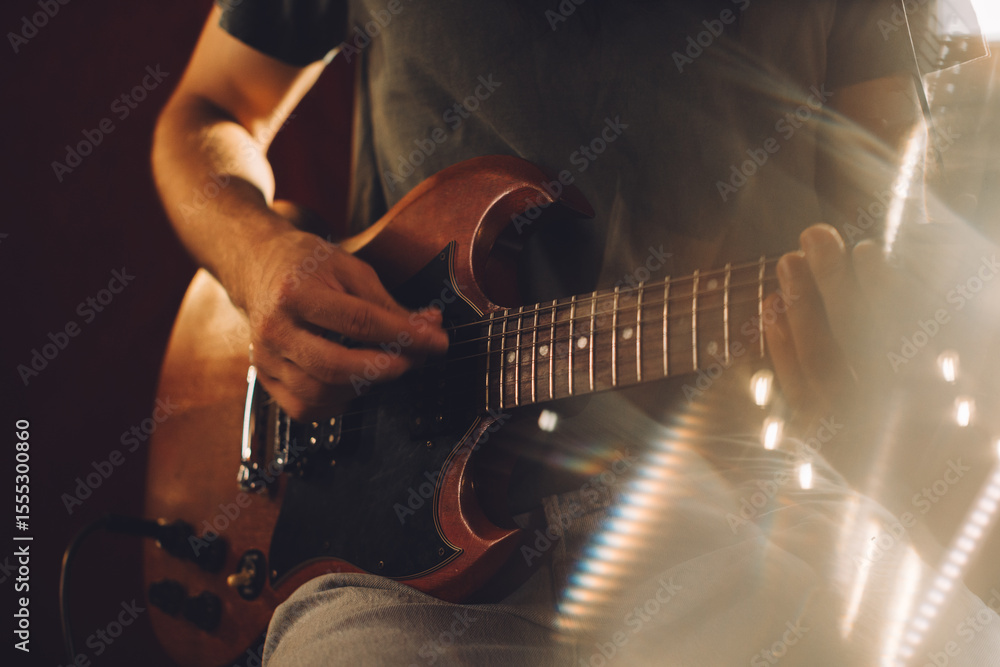 Fototapeta premium Musician playing electric guitar in recording studio