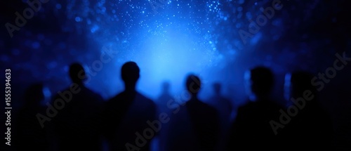 Silhouetted crowd watching blue light show, people, group, concert, audience, performance, dark, night, party