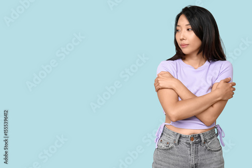 Young Asian woman hugging h...