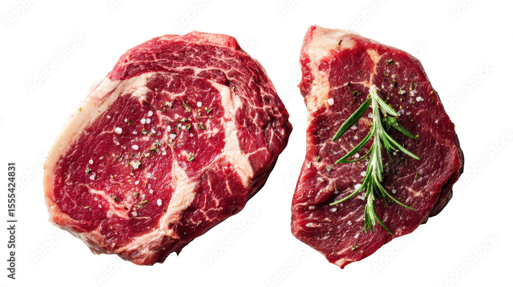 Obraz premium Two juicy beef steaks with herbs on a white isolated background.