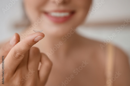 Young woman with contact le...