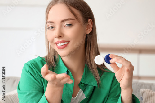 Young woman with contact le...