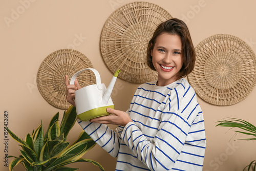 Smiling young woman with wa...