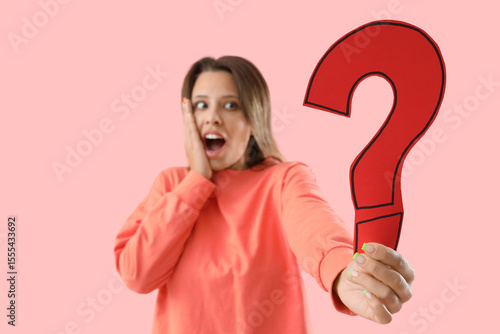 Shocked young woman with pa...