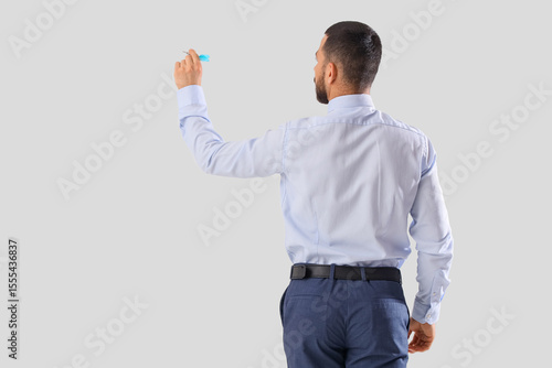 Businessman with dart on li...