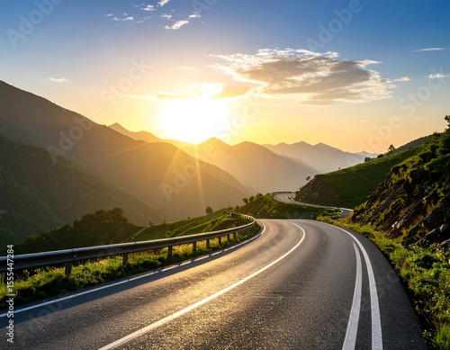 Winding road through mountains at sunset (1)