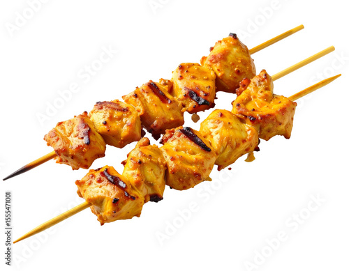Delicious chicken skewers on a dark background