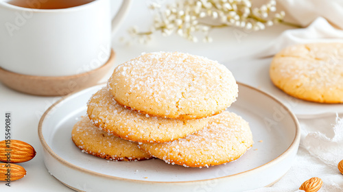 Wallpaper Mural Delicious almond cookies arranged on a plate, perfect for tea time or dessert. Simple and delightful treat for any occasion. Torontodigital.ca