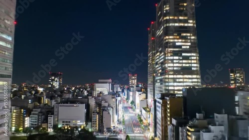 Night View of Illuminated Skyscrapers and City Street in Japan