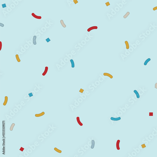 A colorful array of paper shreds, with a light-colored background.