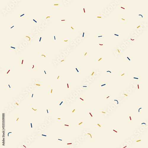 A colorful array of paper shreds, with a light-colored background.