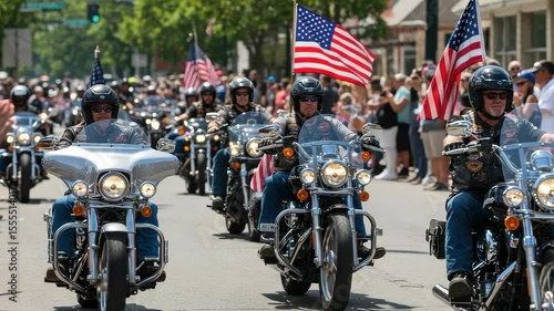 Motorcycle parade with flags through a bustling street during a summer celebration