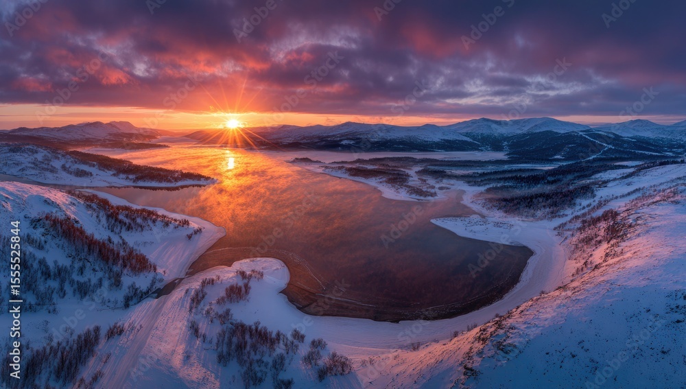 Obraz premium Snowy winter sunrise over a frozen lake