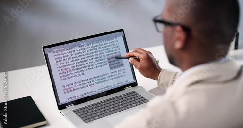 Fototapete Document Proofreading: African American Man Editing Script Online Spelling