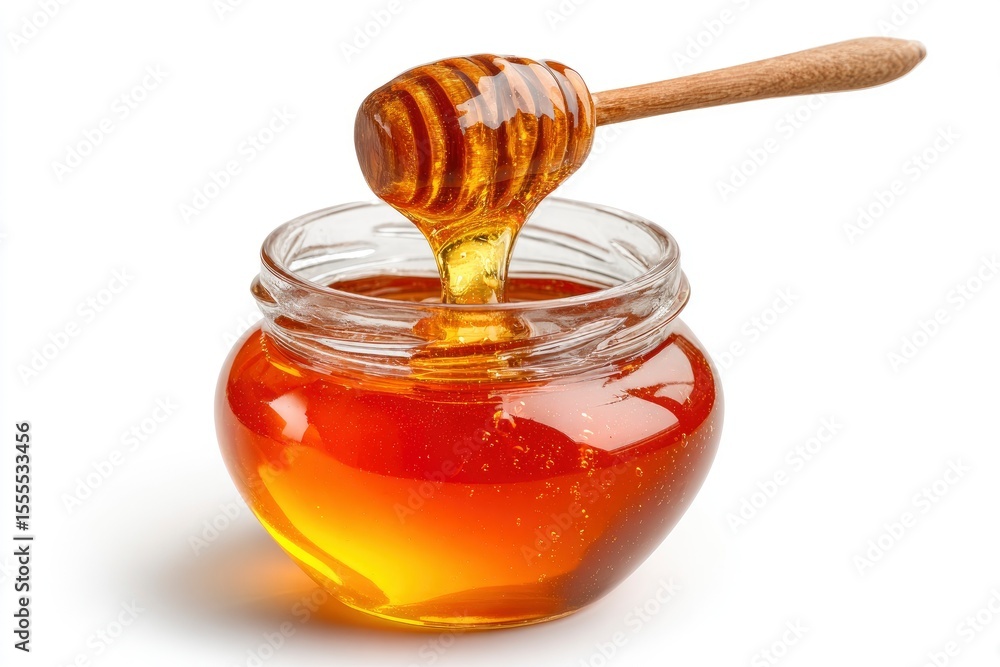 Honey drips from a wooden dipper into a glass jar filled with golden liquid set against a white background Honey drips from a wooden dipper into a glass jar filled with golden liquid set against a white background