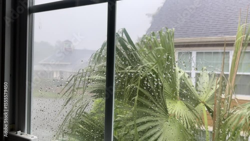Close up residential interior window in stormy day in Florida