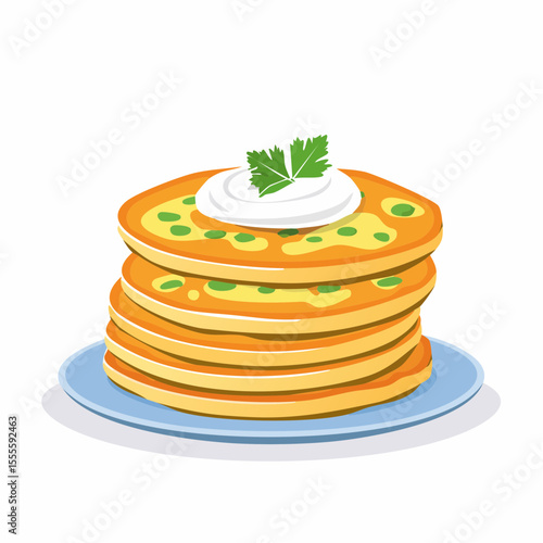 A delicious stack of savory vegetable pancakes topped with sour cream and a fresh parsley garnish, served on a plate.