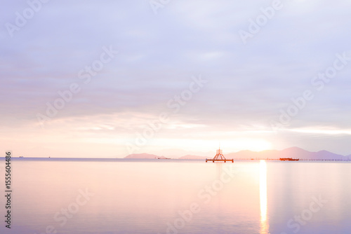 Tranquil Sunrise over Lake Biwa with Floating Structure and Soft Reflections