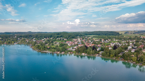 Aerial view over Wörthsee, beautiful lake with small docks in Bayern, Germany.