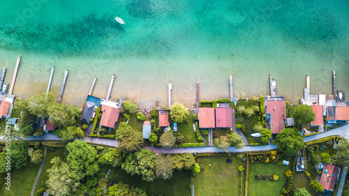 Aerial view over Wörthsee, beautiful lake with small docks in Bayern, Germany.