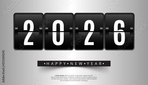 2026 displayed on black mechanical flip clock panels Happy New Year text below on a grey background