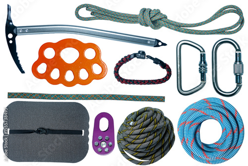 Isolated collection of outdoor climbing equipment: carabiners, eight, rope, ice ax, block roller, rigging plate, etc.